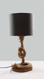 Load image into Gallery viewer, A table lamp with a grey shade, featuring a unique base made of twisted rope and a wooden element, without a lamp color, against a plain background.