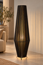 Load image into Gallery viewer, Black rope floor lamp in living room with light on