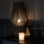Load image into Gallery viewer, Obelisk table lamp illuminated in dark room