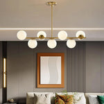 Load image into Gallery viewer, Gold Globo di vetro Chandelier - 7 globes
