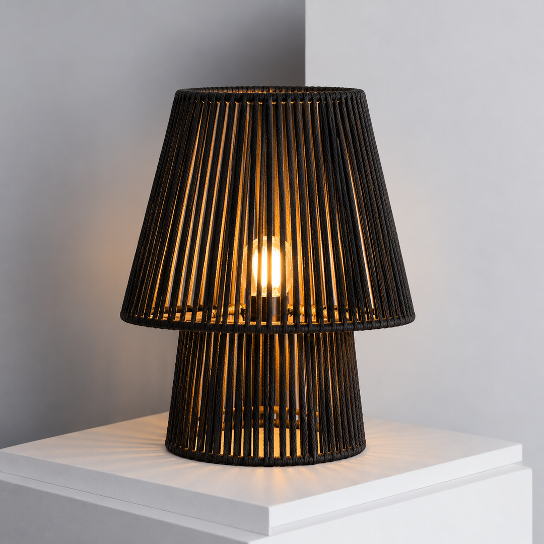 Noura black rope table lamp lights on