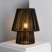 Noura black rope table lamp lights on